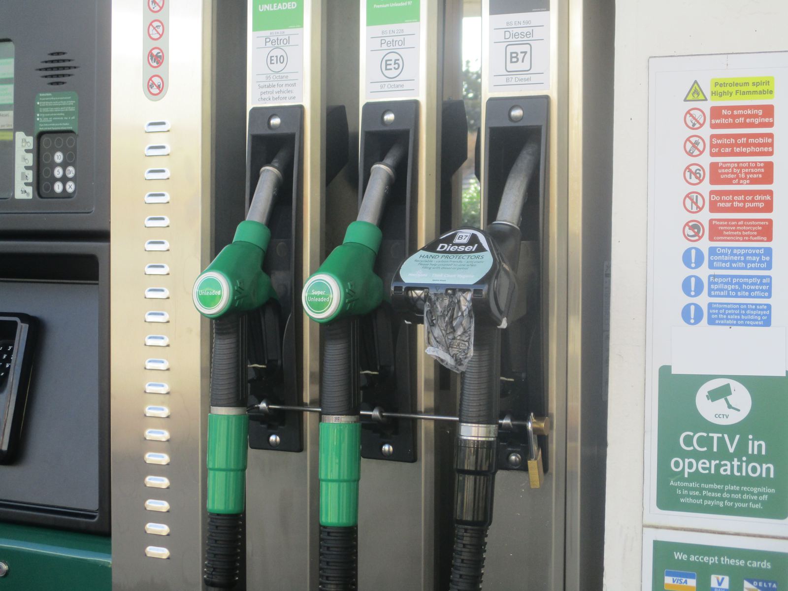 Fuel dispenser nozzles at a petrol station