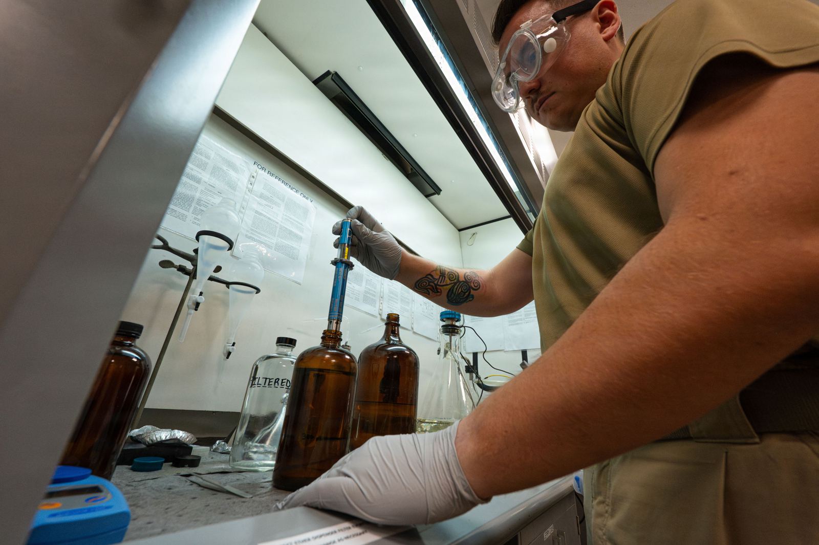 Technician analysing fuel samples in a laboratory