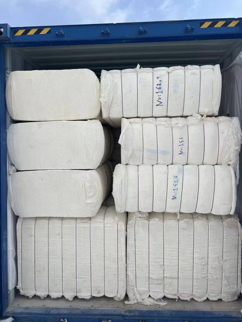 Noor Al-Faroq cotton operations — pressed bales and loading
